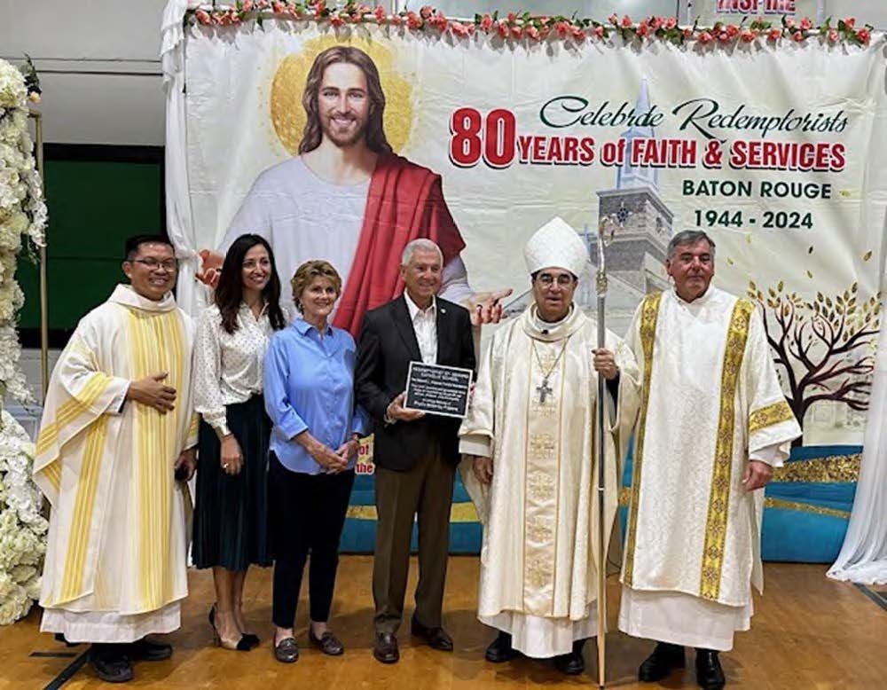 Thanh Vu and Steven Urban welcome one and all to the student mission; and all of the Redemptorist theology students process into St. Gerard Church.