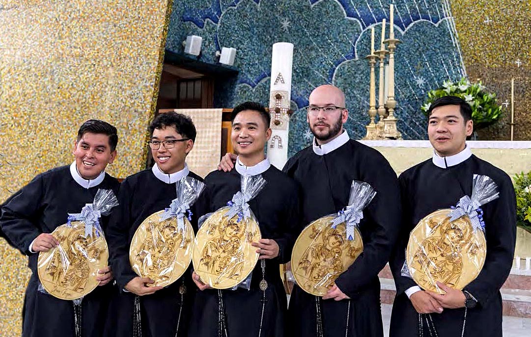 professed The newly professed Efraín Bergsaí, Andrew Tran-Chung, Son Lai, Cody Hill and Dang Nguyen with personalized wooden images of Our Mother of Perpetual Help.