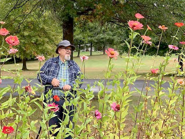 Br. Dan gardening on the Liguori campus.