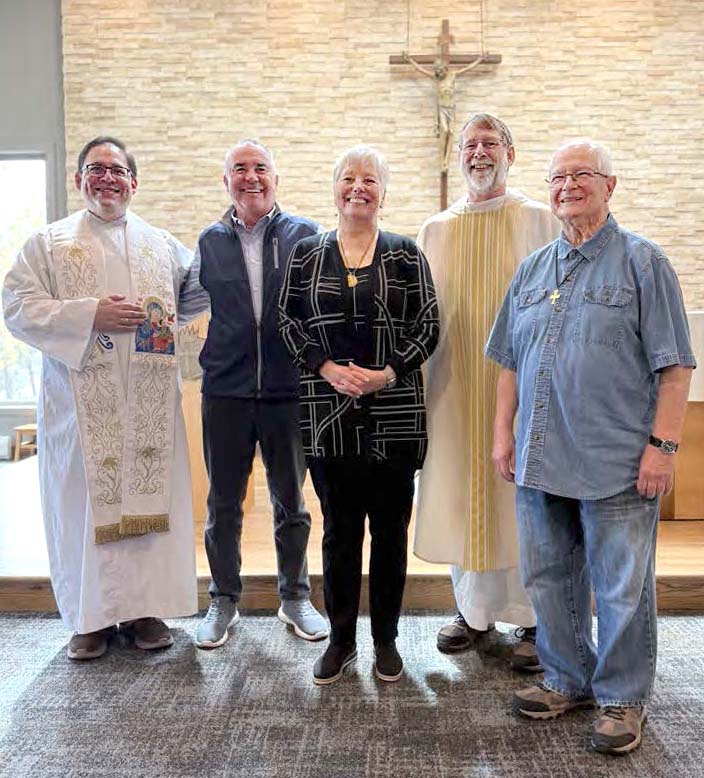 Key participants in Toni Dunning’s commitment ceremony as a Lay Missionary of the Most Holy Redeemer: Fr. Kevin Zubel, Provincial Superior of the Denver Province; Toni’s supportive husband Dave; Toni; Fr. Greg May, who directs the Partner in Mission initiative for the Denver Province; and Fr. Jim White, Toni’s spiritual director.